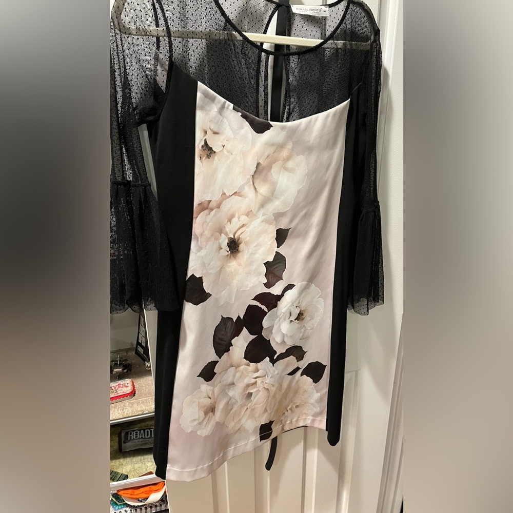 Fabulous dress for cocktails or that special occasion! Sheer bell sleeves.